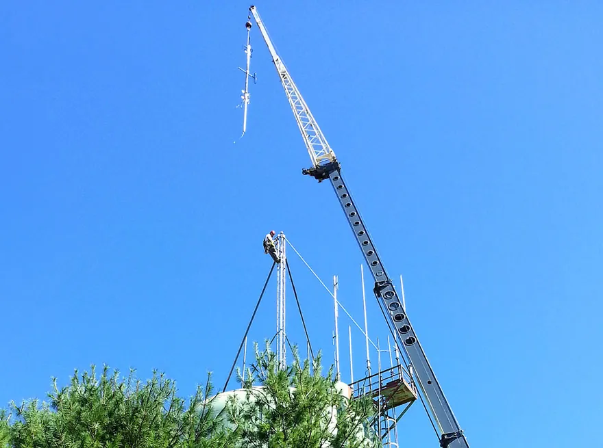 Crane lifting a tower section into place